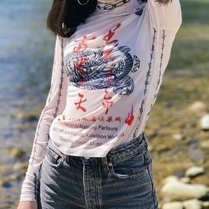 Mukzin layering top. Tattoo